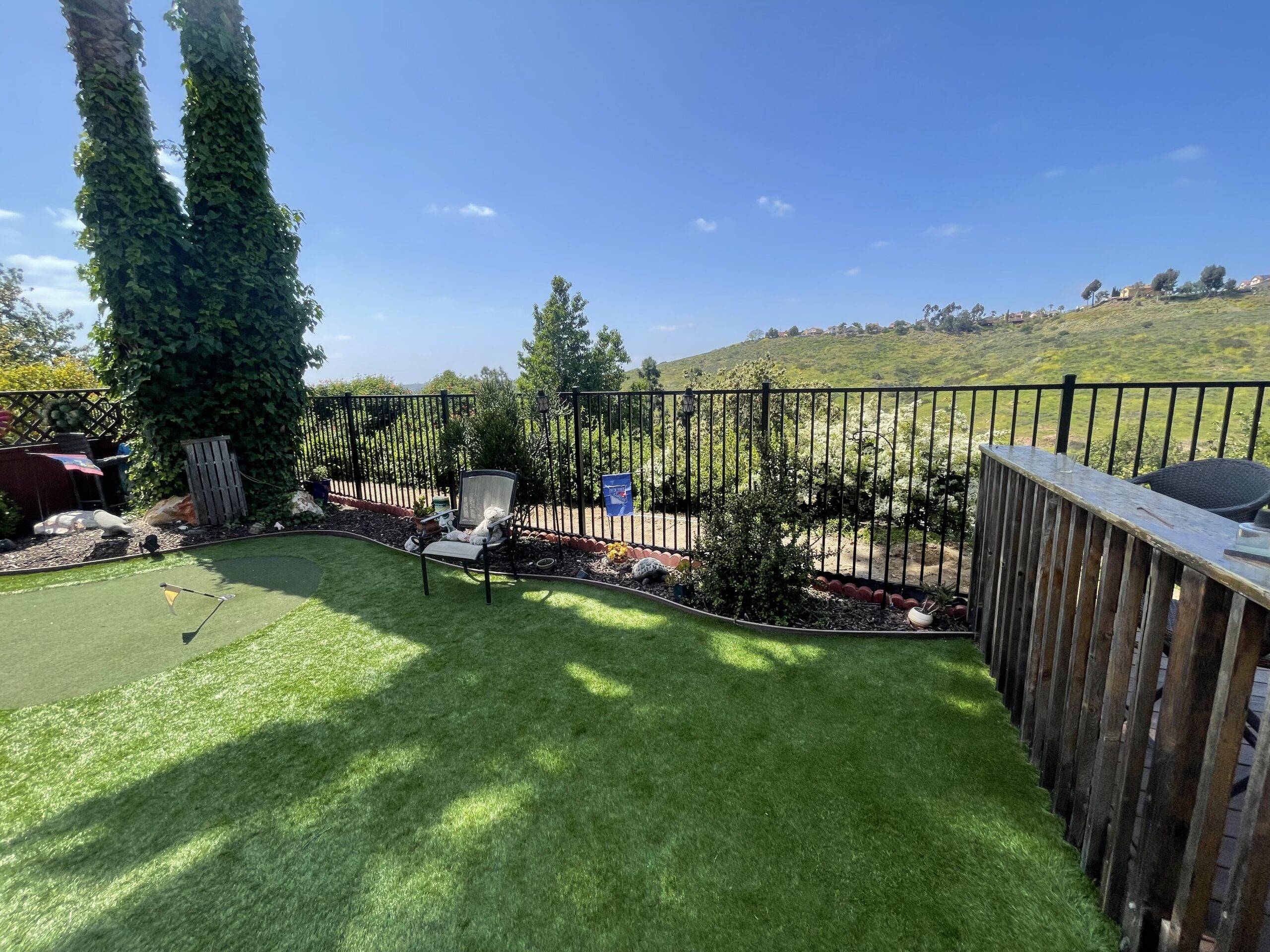 Alumax aluminum fence around the perimeter of a yard backing up to the Poway hills in San Diego