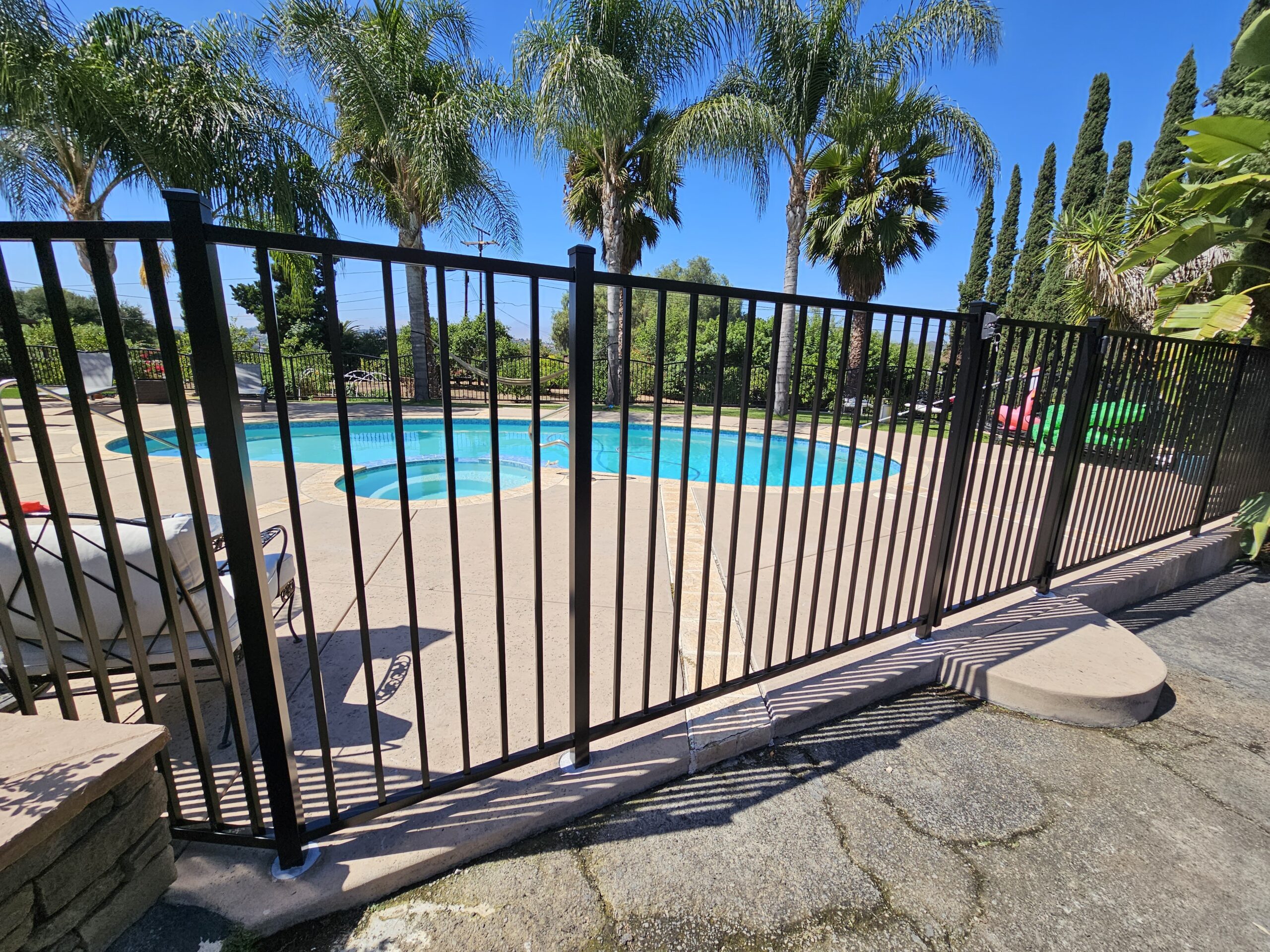 Commercial alum fence to protect the pool and increase curb appeal.