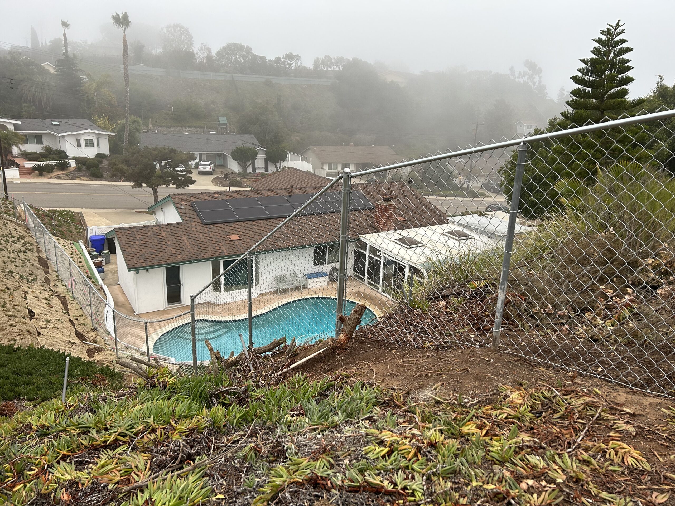 Chain Link Fence installed up a steep Hill in San Diego