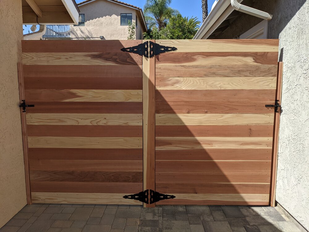 Side yard fence and gate made of redwood