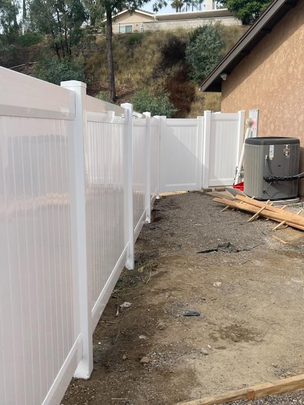 Vinyl fence attached to Side of San Diego house