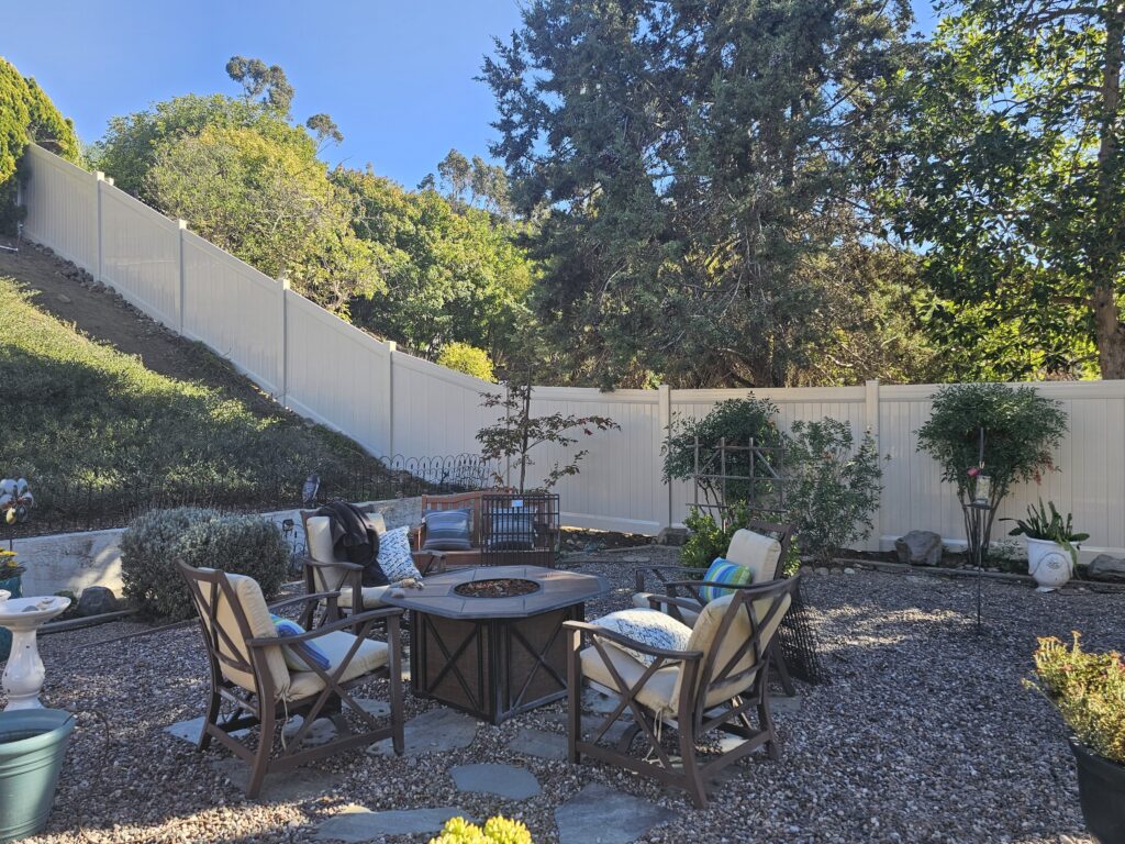 vinyl fence installed on steep backyard in Sabre Springs san diego