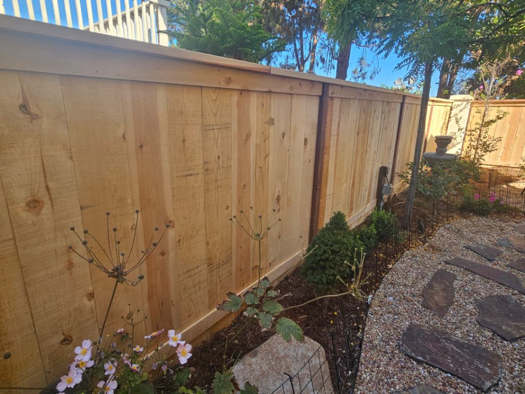 Wooden fence post installation in Encinitas, CA.