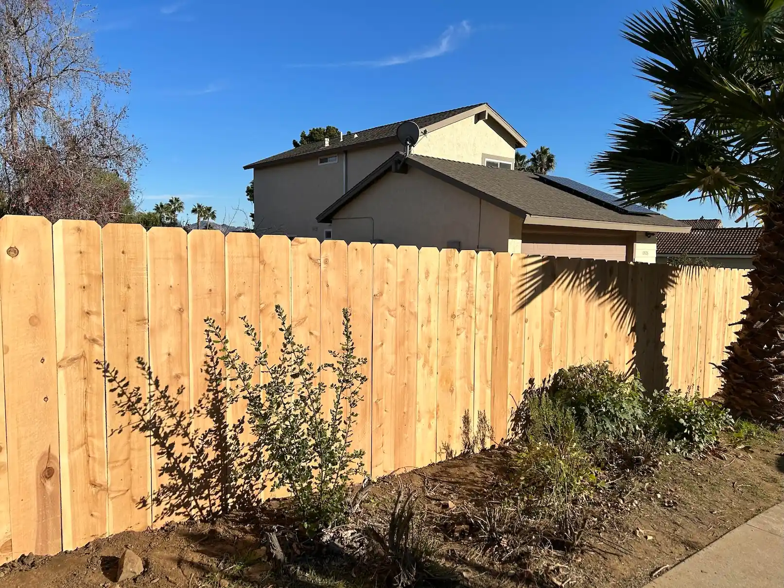 tall wooden privacy fence construction by San Diego wood fence builders