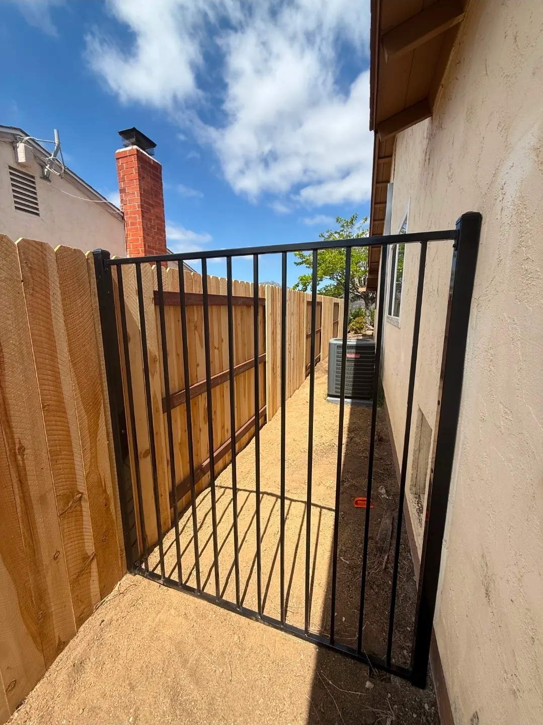Aluminum Pool Fence for security 5 foot wrought iron fence section installed in San Diego to make the home zone zero compliant.
